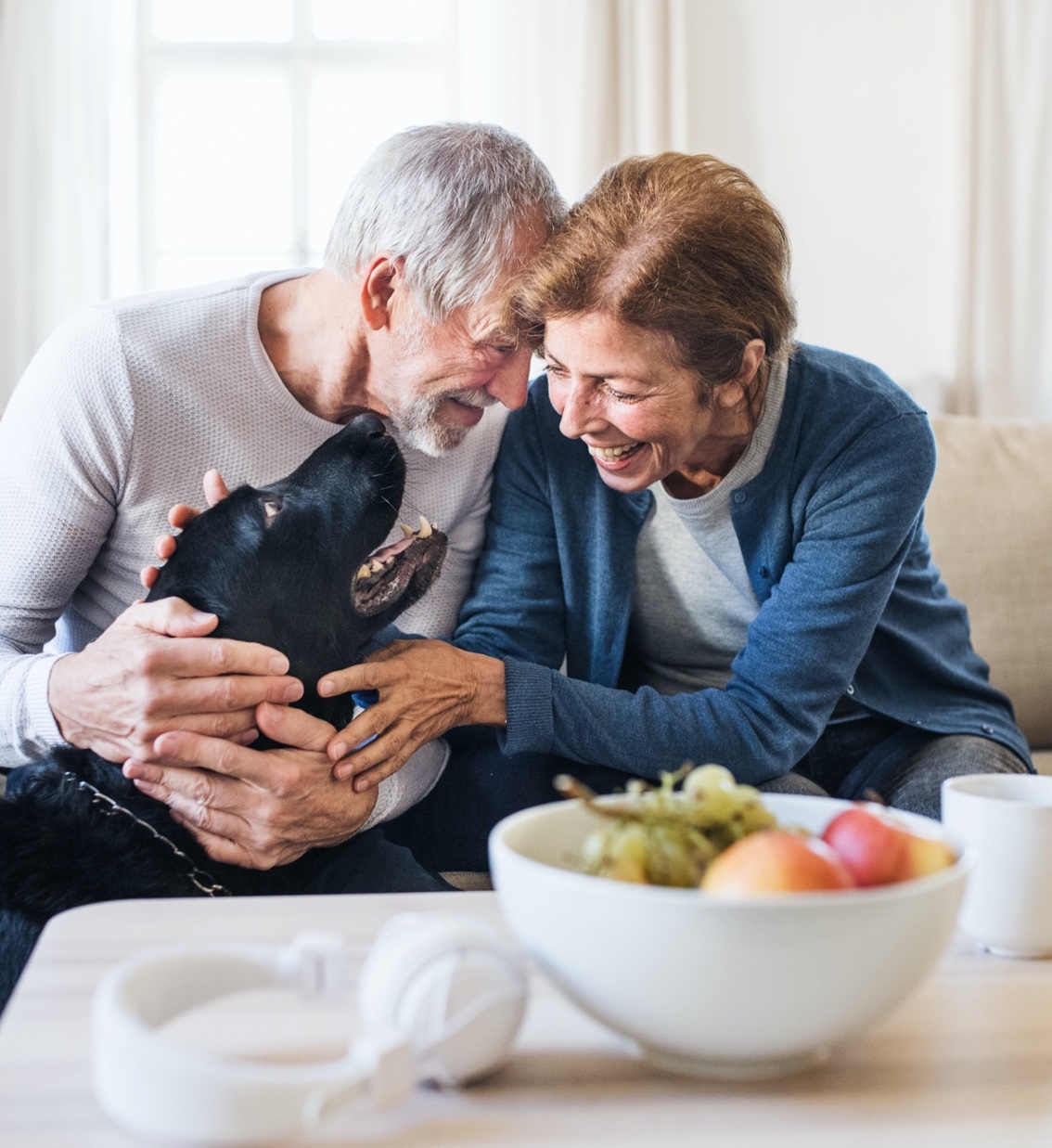 older couple laughing over phone