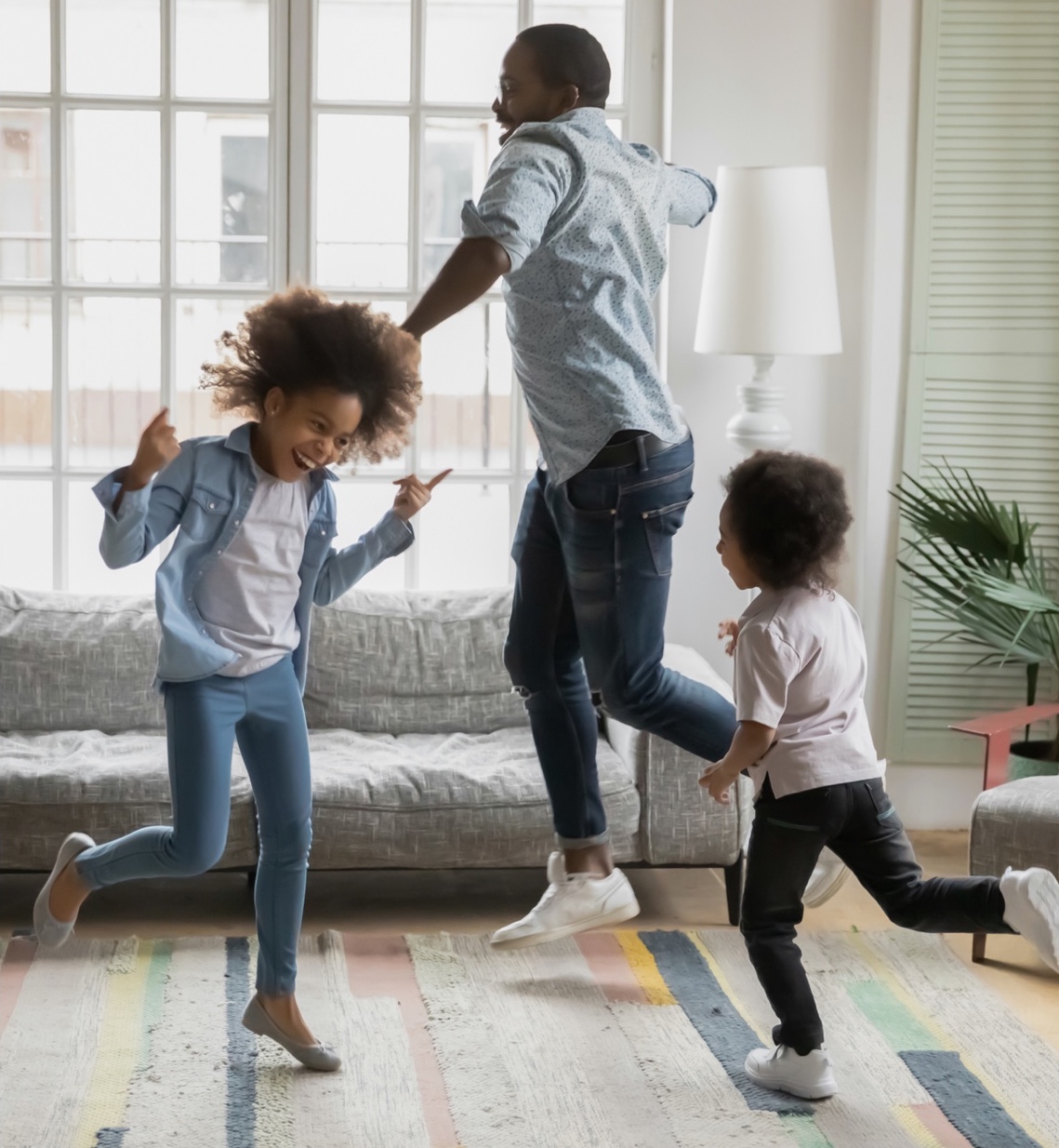 a family dancing and playing