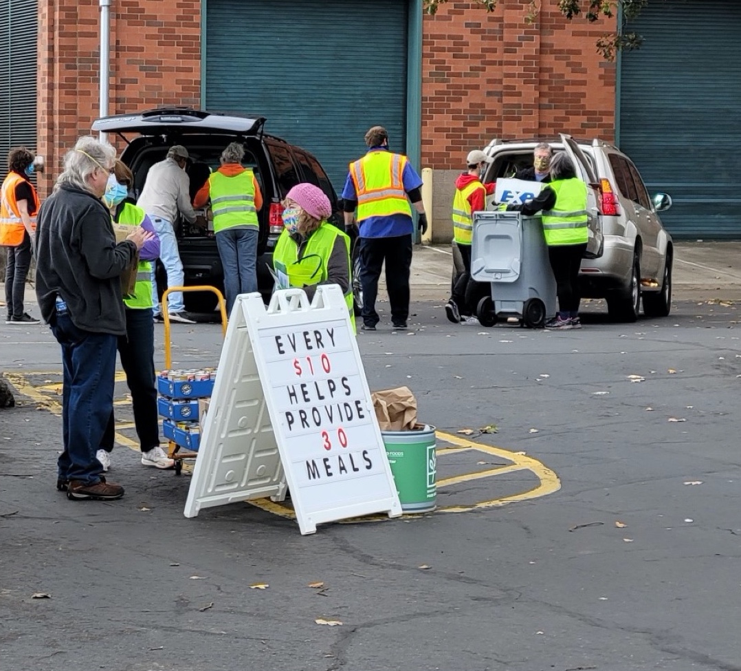 a group doing charity work together outside